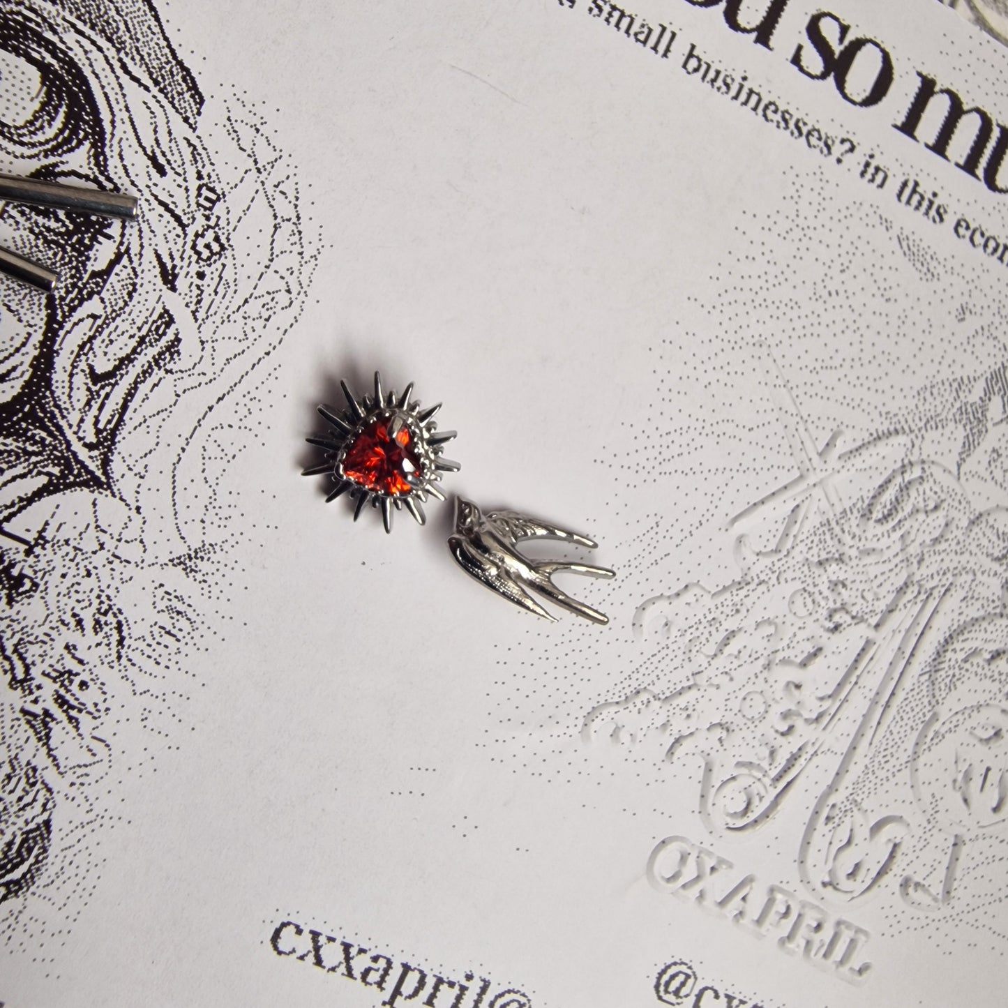 Don't shoot the messenger | Asymmetric Titanium Silver Bird Earring and Red Zircon Cartilage Stud Set