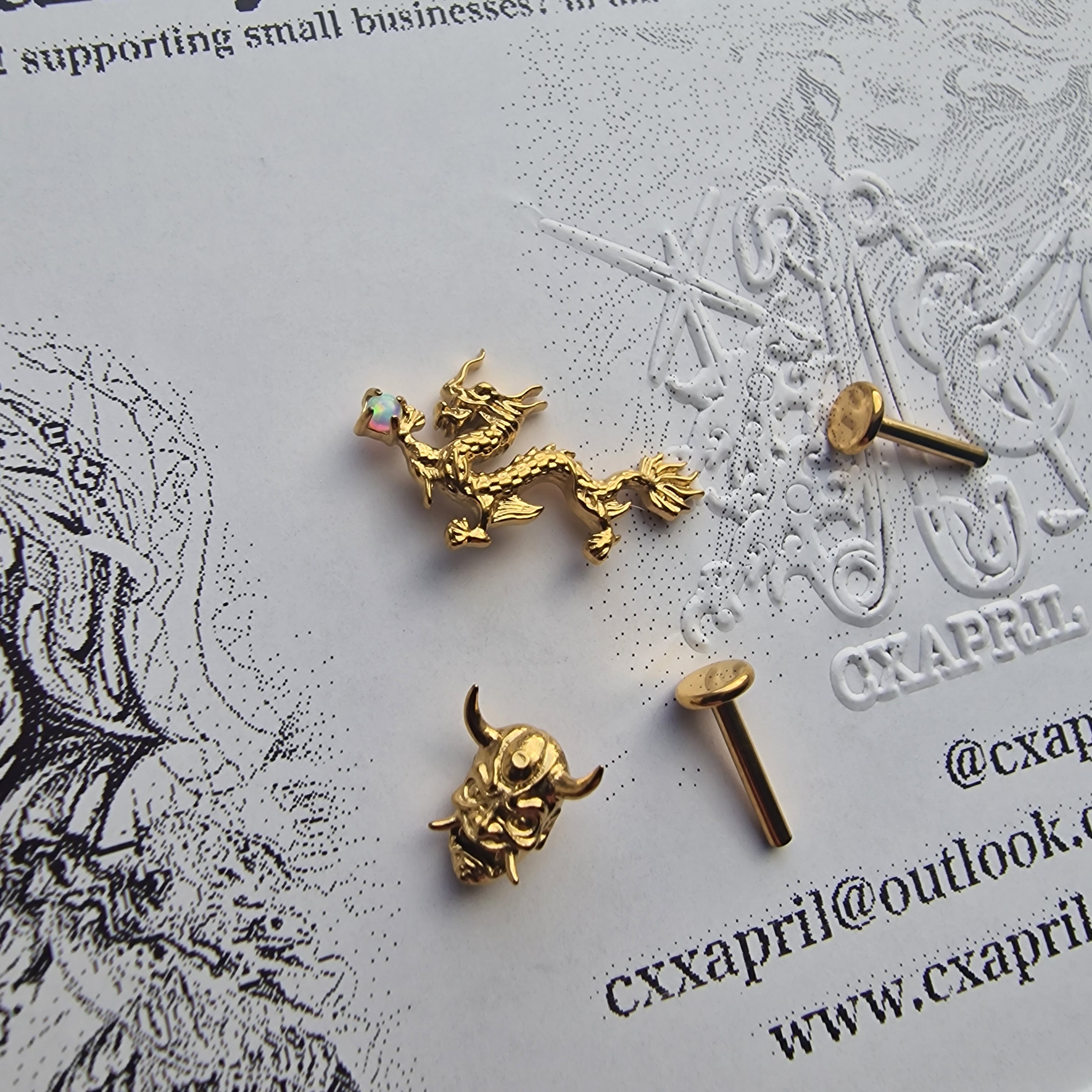 Anime Inspired Dragon and Mask Asymmetric Gold Titanium Earring Set | Titanium Gold Asian Body Piercings and Jewellery