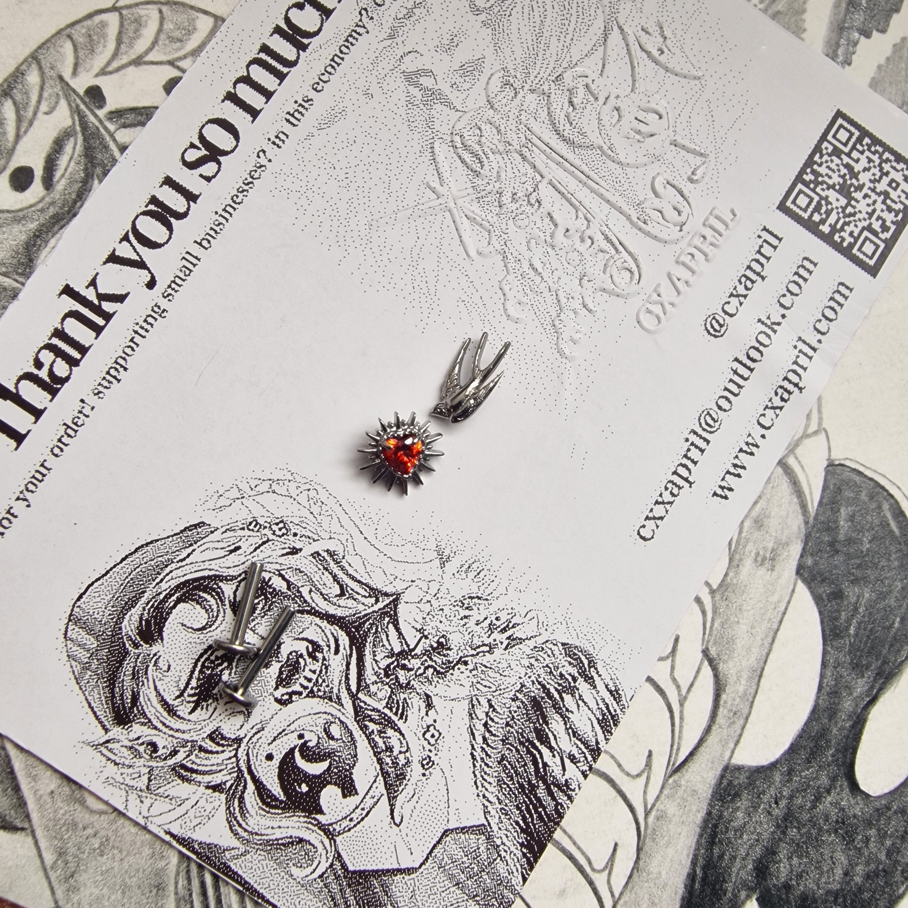 Don't shoot the messenger | Asymmetric Titanium Silver Bird Earring and Red Zircon Cartilage Stud Set