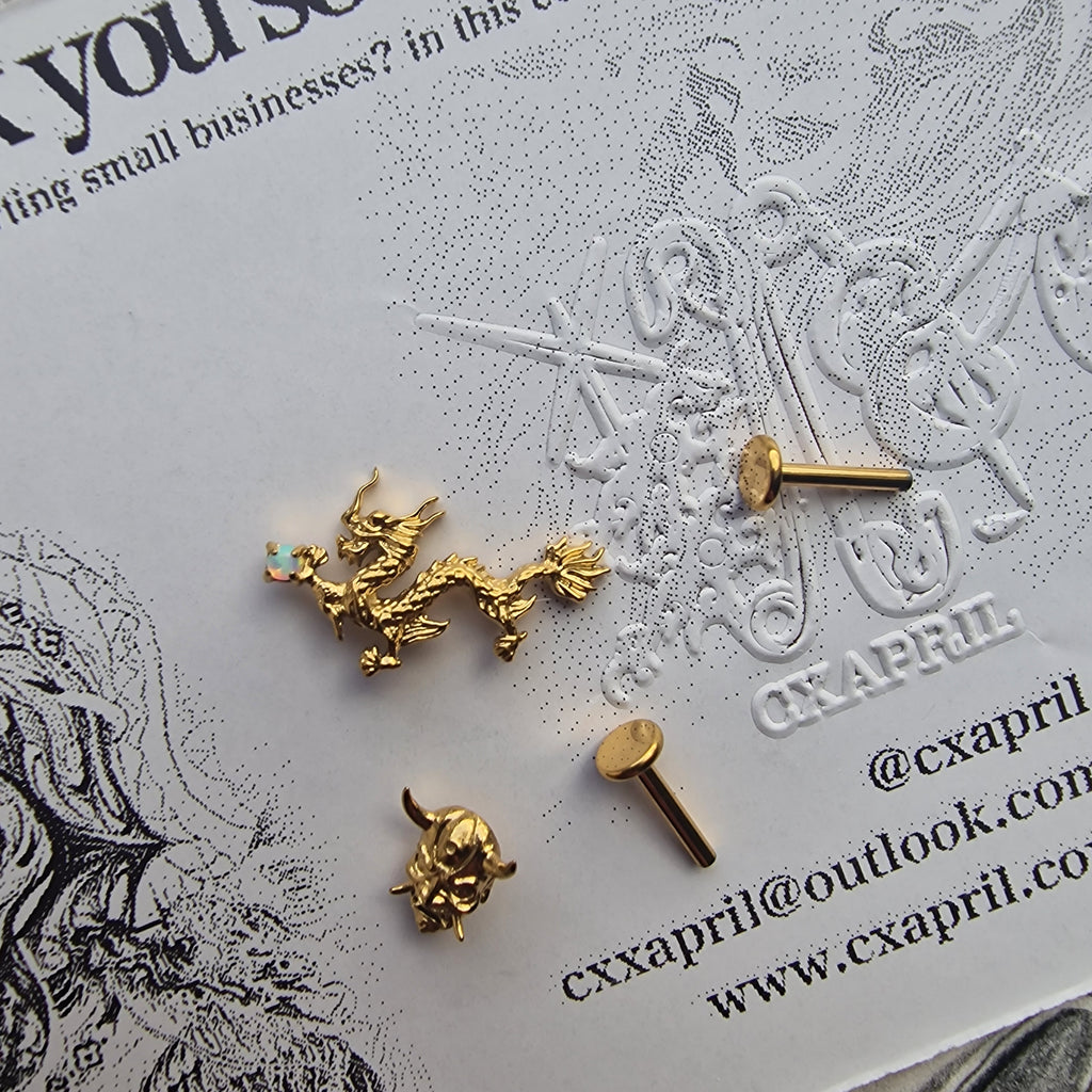 Anime Inspired Dragon and Mask Asymmetric Gold Titanium Earring Set | Titanium Gold Asian Body Piercings and Jewellery
