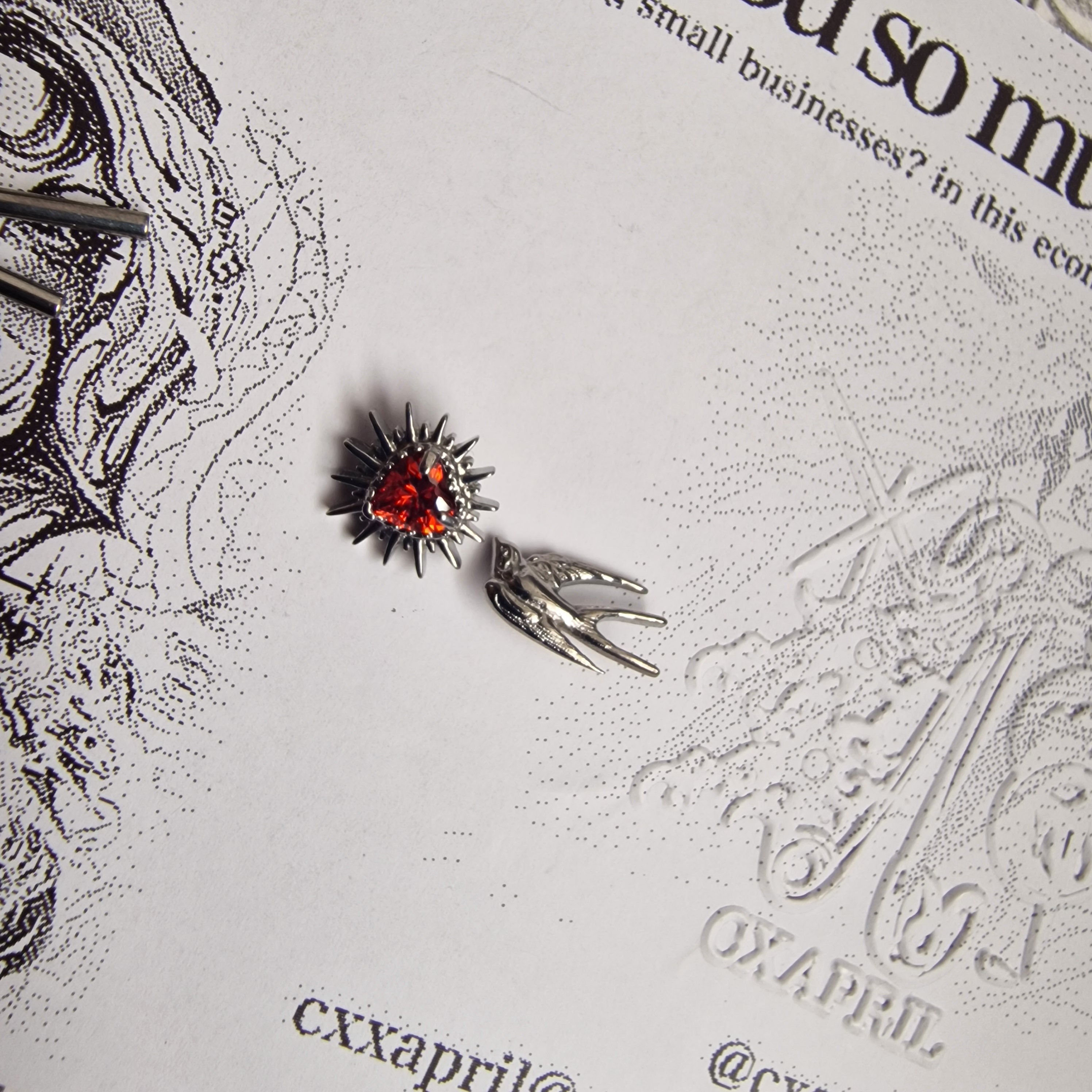 Don't shoot the messenger | Asymmetric Titanium Silver Bird Earring and Red Zircon Cartilage Stud Set