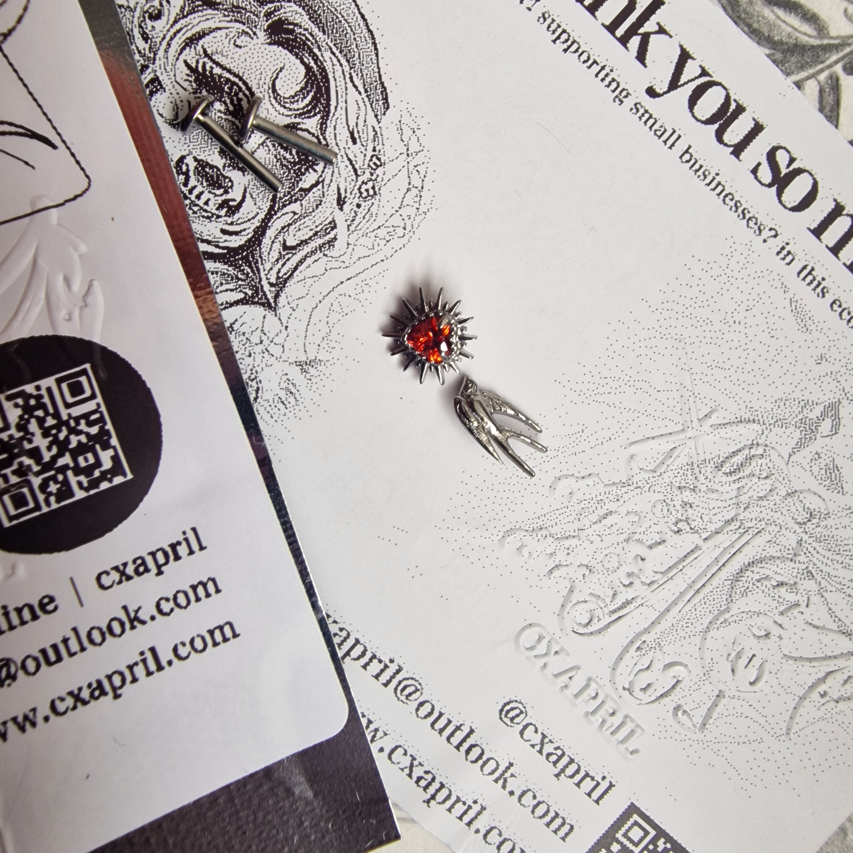Don't shoot the messenger | Asymmetric Titanium Silver Bird Earring and Red Zircon Cartilage Stud Set